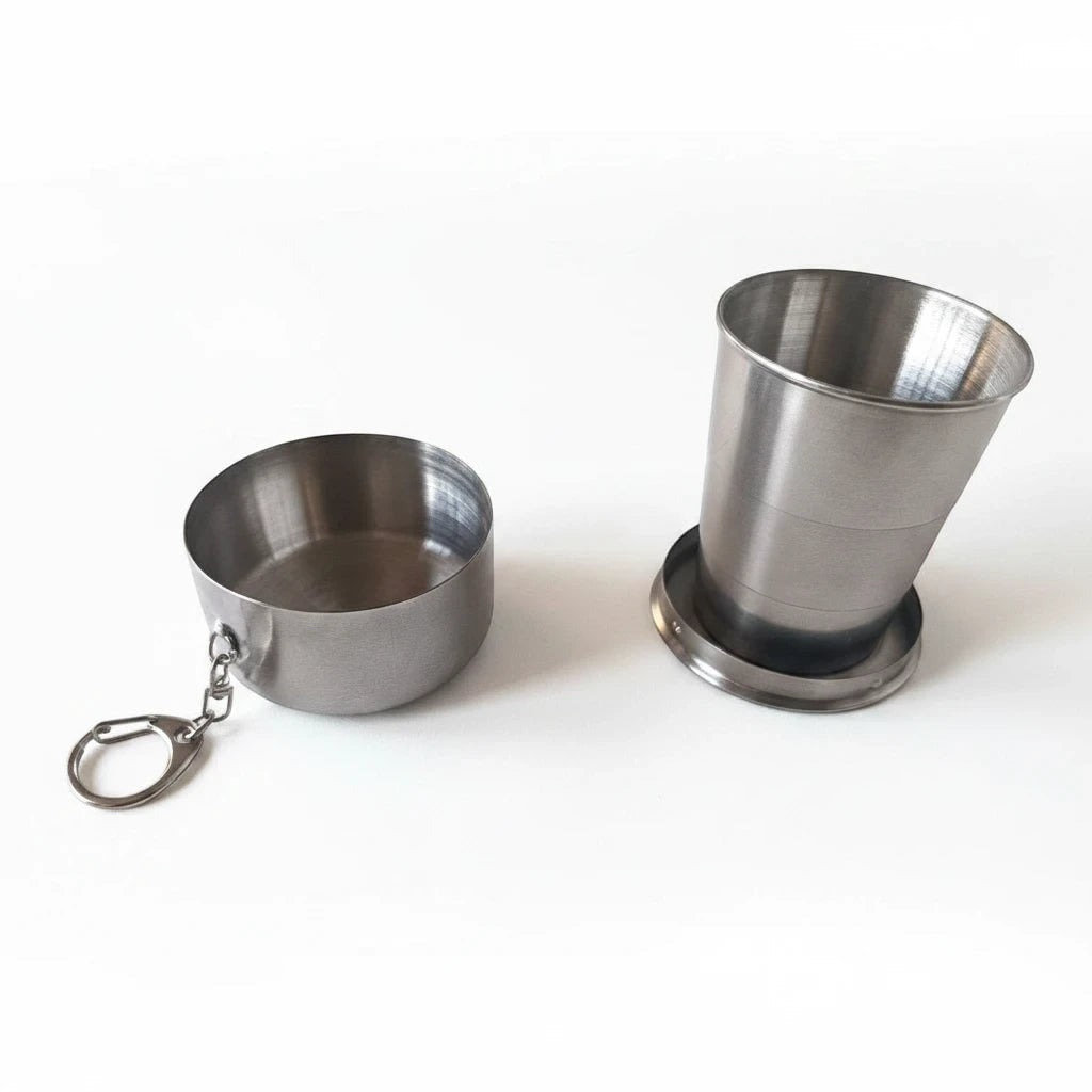 Campus Zone stainless steel collapsible travel cup shown in both folded disc and expanded cup forms with keychain.