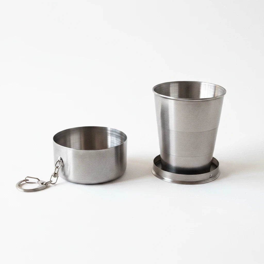 Campus Zone collapsible stainless steel travel cup shown in both folded and expanded positions with a keychain clip.