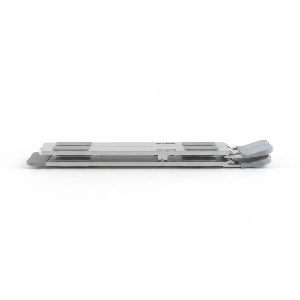 Campus Zone foldable aluminium laptop stand in a collapsed, flat position with grey rubber grip pads.