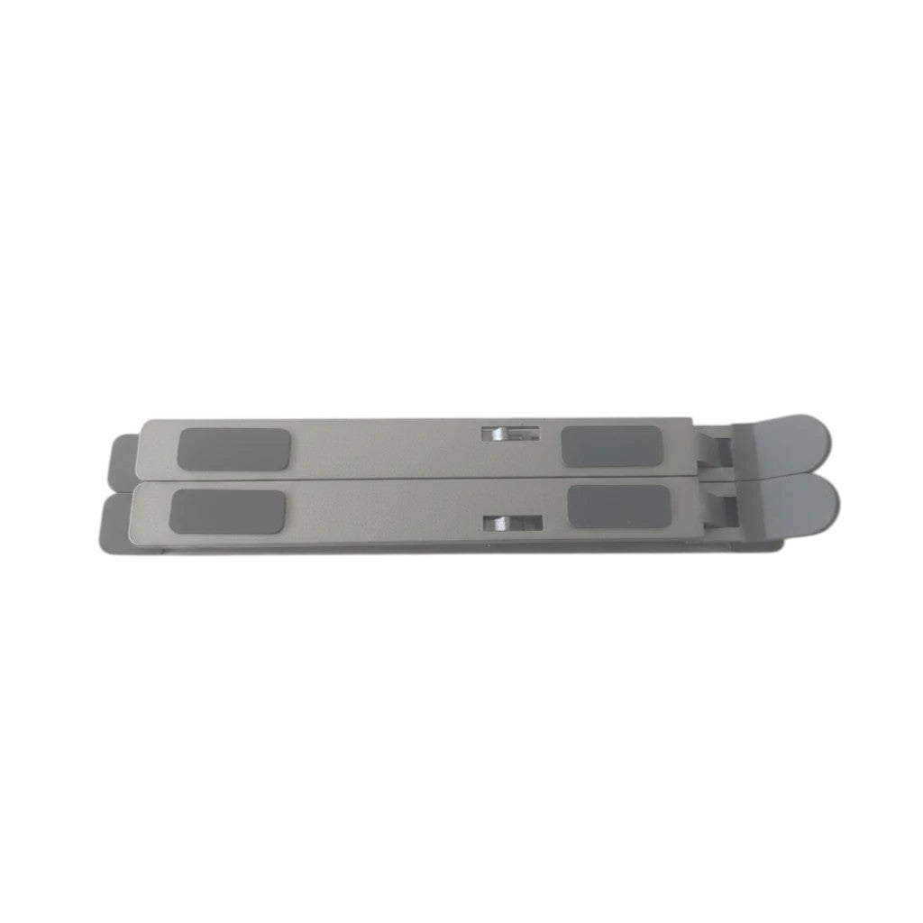 Campus Zone foldable silver aluminium laptop stand in a compact, flat-folded position with grey rubber grip pads.