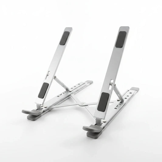 Campus Zone silver aluminium foldable laptop stand with adjustable X-brace mechanism and protective rubber grip pads.