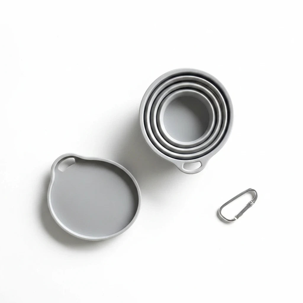 Campus Zone grey collapsible silicone travel cup with lid and metal carabiner clip shown from a top-down view