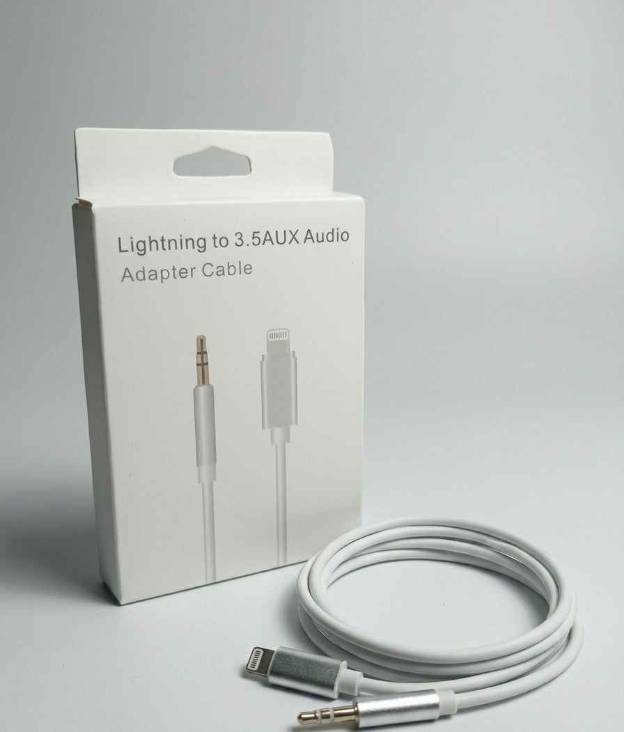 A white Lightning to 3.5 AUX audio adapter cable shown next to its white retail box on a light gray background.